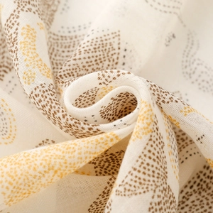 Close-up of lightweight ethnic print scarf showing soft texture and detailed leaf patterns
