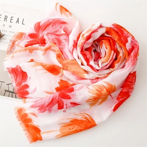 Artistic heart-shaped fold of floral cotton-linen scarf with orange flower patterns