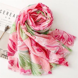 Detail of pink floral cotton linen scarf with soft fringe edges and vivid herringbone pattern