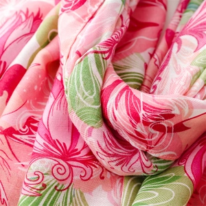 Detail of pink and green cotton-linen feel scarf with fine woven texture and draping fabric