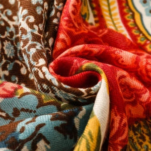 Macro detail of bohemian paisley print on soft textured linen-feel fabric scarf