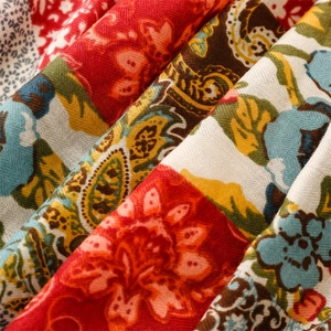 Close-up of bohemian paisley floral pattern on textured cotton-linen fabric shawl
