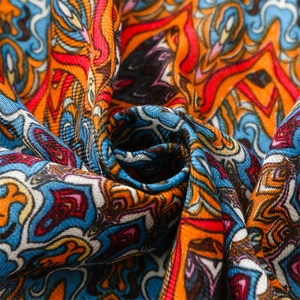 Macro shot of colorful paisley pattern on ethnic bohemian cotton linen woven shawl fabric