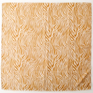 Lightweight amber and beige zebra print chiffon scarf with delicate fringe edges