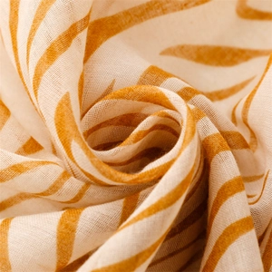 Detail of yellow zebra print scarf showing fine cotton blend fabric texture and soft drapes