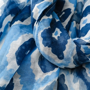 Detailed texture of blue and white floral pattern on lightweight cotton linen scarf