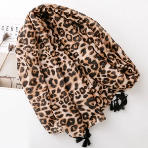 Lightweight leopard print scarf with black fringe tassels and breathable fabric