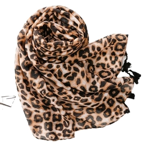 Leopard print voile scarf with soft black fringe tassels for sun protection and fashion