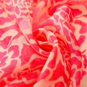 Macro view of lightweight pink floral voile scarf with soft semi-transparent texture