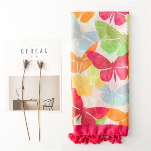 Colorful butterfly print scarf with pink tassels and a lightweight gauze texture
