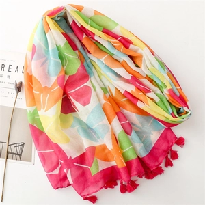 Lightweight colorful floral print scarf with bright pink tassels on white background