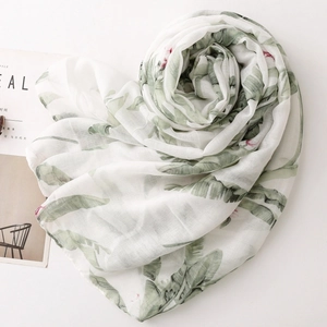 Lightweight bali yarn scarf with tropical banana leaf prints and pink floral accents