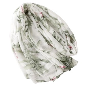 Lightweight tropical palm leaf print scarf with pink floral design and tassels