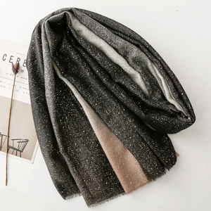 Detail of gradient scarf with gold foil printing and delicate fringe tassel edges