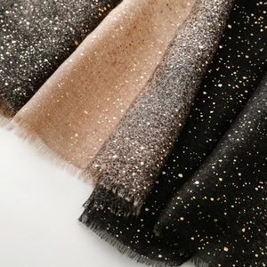 Detail of cotton-linen feel scarf with gold foil speckles and fringe edges