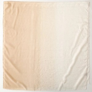 Detail view of cotton linen scarf with gradient pink to cream and silver glitter finish