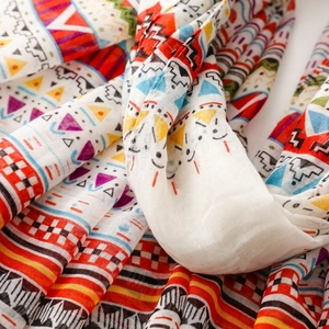 Detailed view of colorful bohemian geometric patterns and textures on a soft scarf