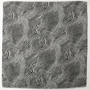 Lightweight zebra stripe scarf with fringe edges in black and white wave pattern