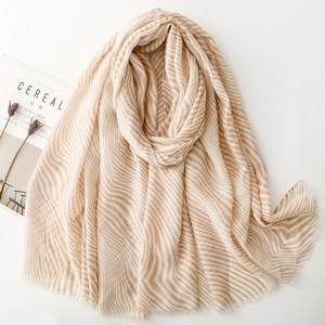 Beige zebra striped cotton scarf with fringe details styled with aesthetic props