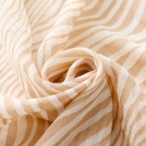 Detail shot of zebra stripe cotton silk scarf showing soft texture and fine weave