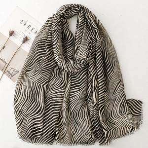 Zebra striped long scarf in black and beige with frayed fringe edges for women