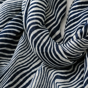 Close-up of zebra pattern silk scarf showing soft knit texture and striped detail