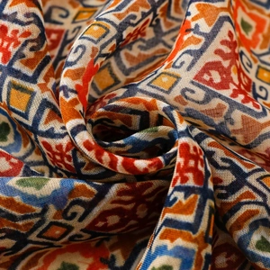 Detailed close-up of woven fabric showing colorful geometric patterns and fabric texture