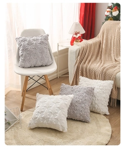 Close-up of white plush pillowcase with 3D embroidered Christmas tree pattern texture