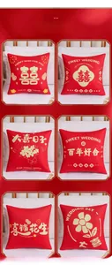 Detail of six Chinese wedding pillow covers with red plush fabric and golden Xi patterns