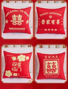 Detail view showing four digital print red velvet wedding pillows with golden Double Happiness