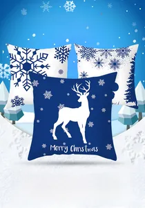 Detailed close-up of blue and white Christmas deer and snowflake pattern pillow covers