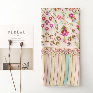 Floral mandala and striped lightweight silk scarf with fringe on a white background