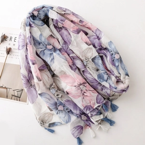 Floral print long scarf with tassels in blue and purple hues on elegant white background