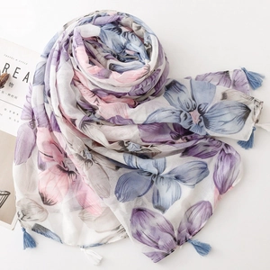 Detailed view of floral voile scarf with soft tassels and watercolor flower patterns