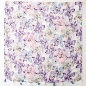 Elegant floral print scarf in blue and lilac with decorative fringe tassels