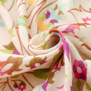 Detail of floral printed satin cotton scarf with colorful pattern and soft texture