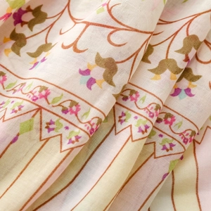 Close-up of floral and striped pattern on lightweight cotton silk scarf fabric texture