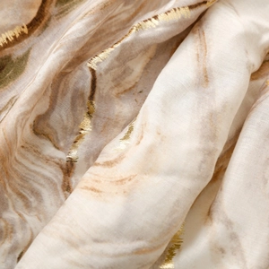 Detailed macro view of marble pattern scarf with elegant gold foil lines and soft texture