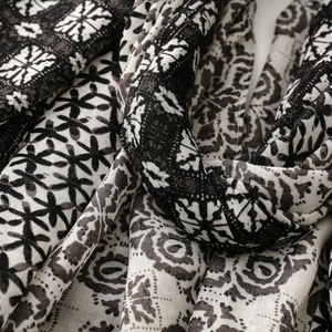 Close-up of geometric pattern and soft texture on black and white cotton linen scarf