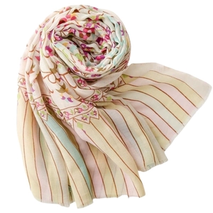 Floral and striped scarf with fringe edges in soft beige, pink, and green tones