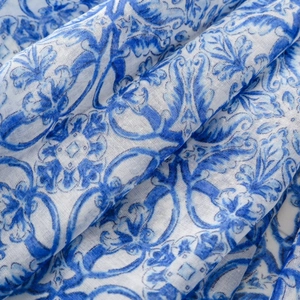 Detail of blue porcelain pattern print on soft bohemian chiffon fabric with tassels