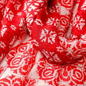 Close-up of red and beige mandala pattern scarf with soft cotton-linen texture