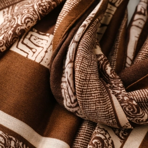 Close-up of vintage paisley and geometric patterns on a thick cotton-linen scarf
