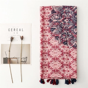 Bohemian mandala print scarf with tassels in red and blue on a minimalist white background