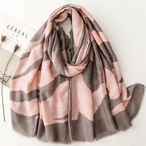 Elegant pink and gray shawl with geometric wavy print and delicate fringe edges