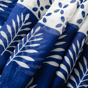 Detail of blue and white floral pattern on breathable ethnic style cotton scarf