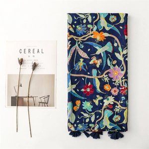 Bohemian navy blue scarf featuring hummingbird and floral prints with tassel edges