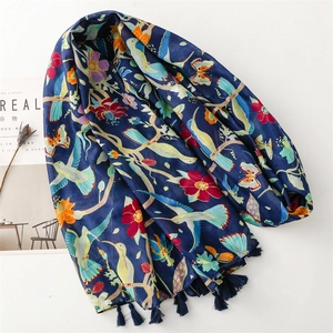 Dark blue floral scarf with hummingbird prints and fringes on white background