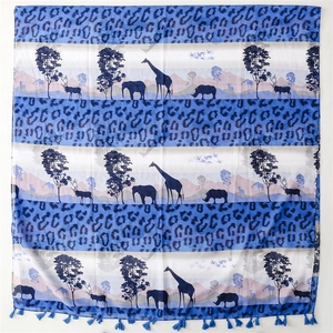 Blue and white scarf featuring giraffe leopard prints and tassels on plain white background