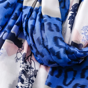 Close-up of royal blue and pink leopard floral print scarf with soft fabric folds